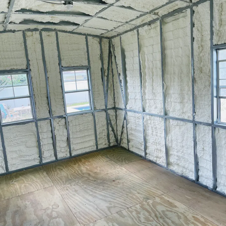 Closed-cell spray foam insulation applied to wall cavities in a residential project in Estero